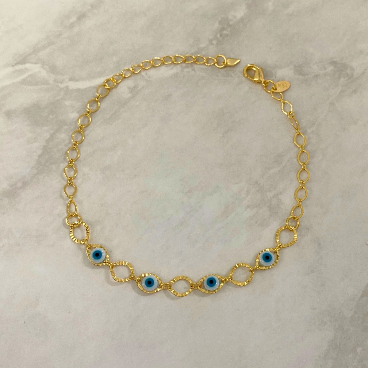 PULSEIRA COM CIRCULO VAZADO E OLHO GREGO