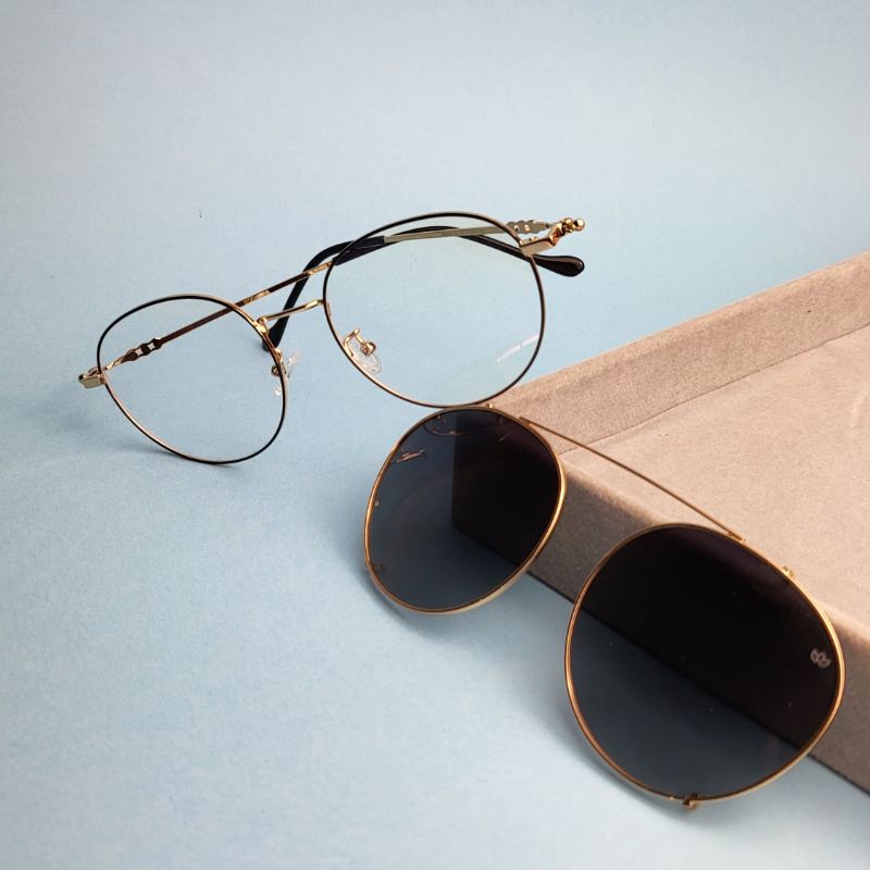 Oculos redondo clip-on cinza armacao dourada