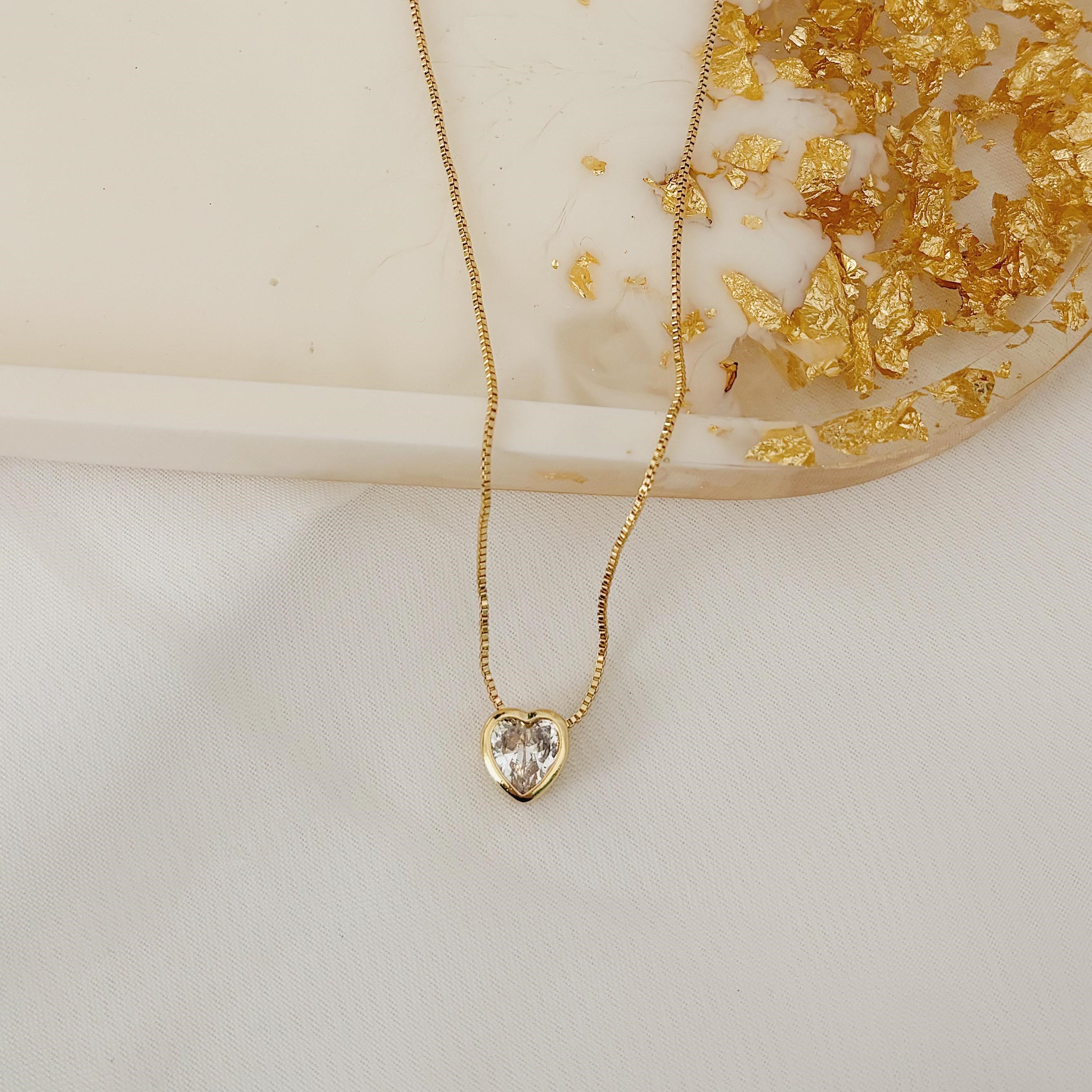COLAR COM PONTO DE LUZ CORAÇÃO 8MM. 45CM DE COMPRIMENTO E 5CM DE REGULAGEM. BANHADO A OURO 18K.