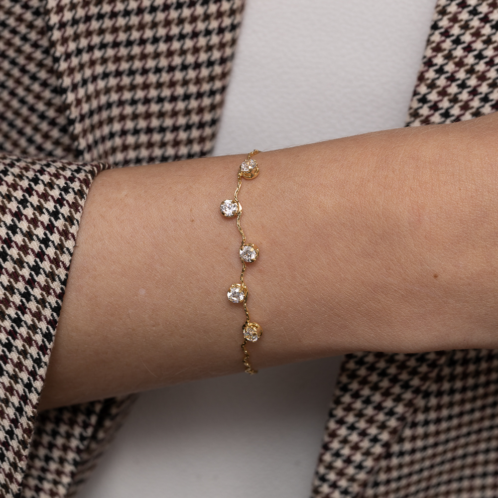 PULSEIRA ONDULADA COM PEDRAS CRISTAIS BANHO 18K