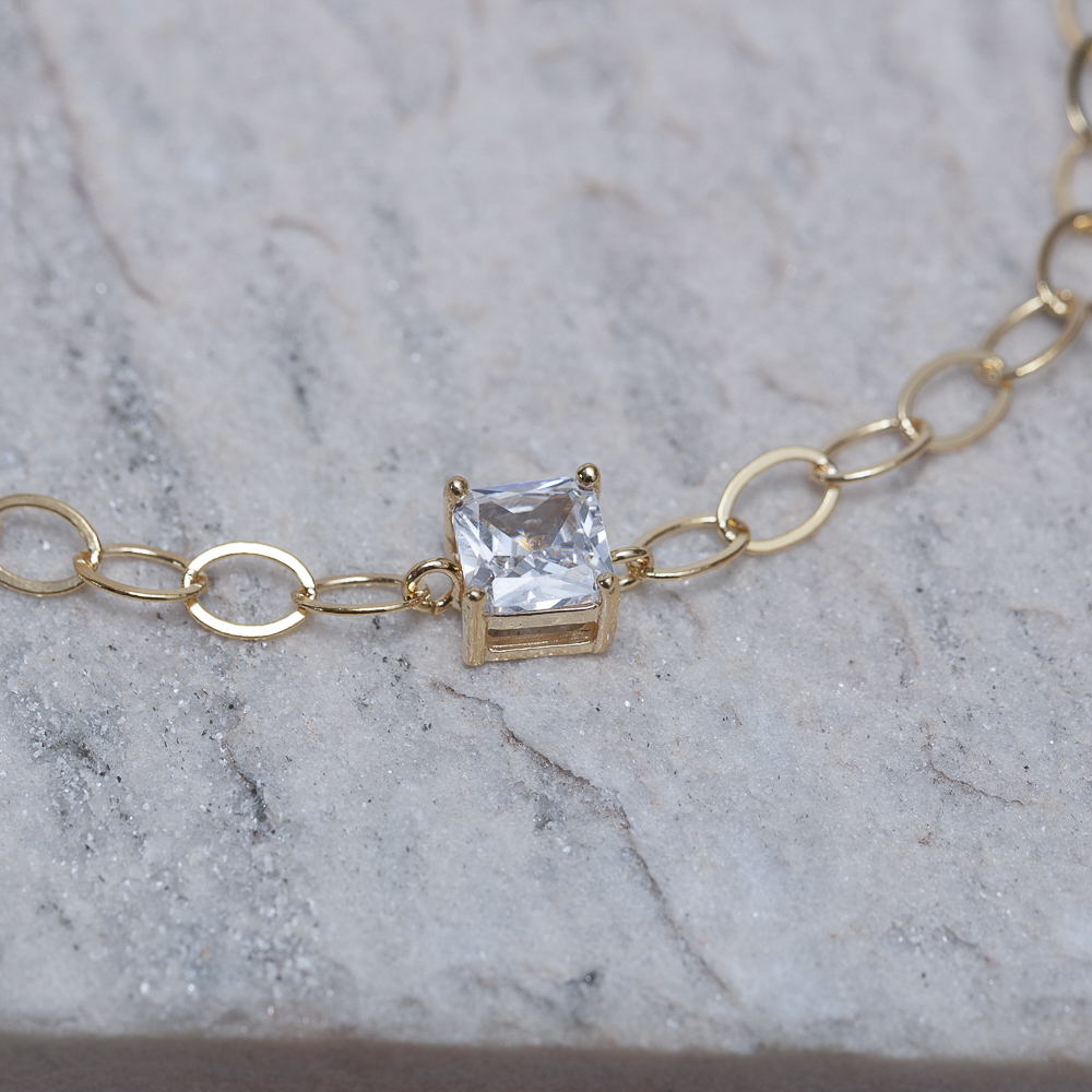 PULSEIRA ELOS OVAIS COM PONTO DE LUZ BANHO 18K