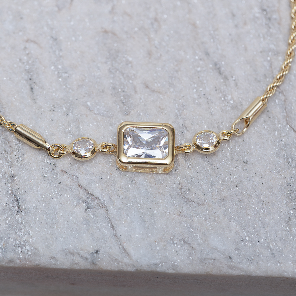 PULSEIRA CABO DE AÇO PP E PEDRA CRISTAL BANHO 18K