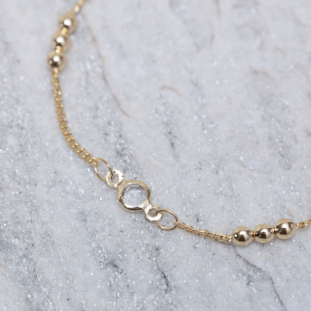 PULSEIRA BOLINHAS E CRISTAIS BANHO OURO 18K