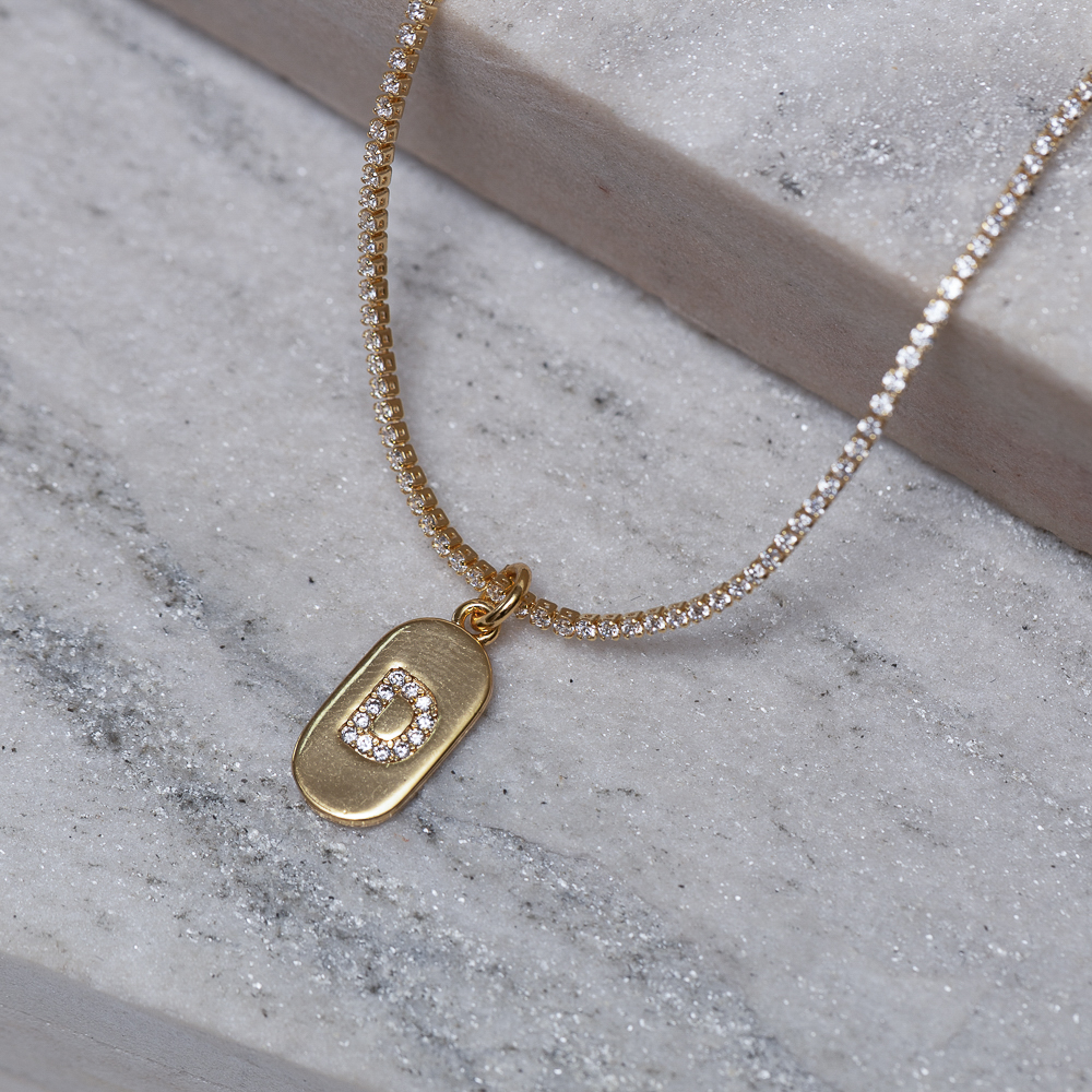 CHOKER RIVIERA PP COM LETRA D CRISTAL BANHO OURO 18K