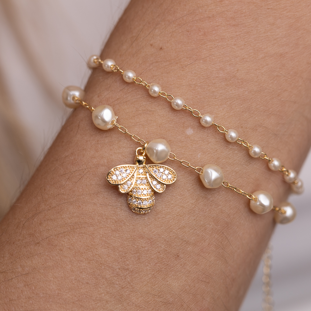 PULSEIRA PÉROLAS PP BANHO OURO 18K