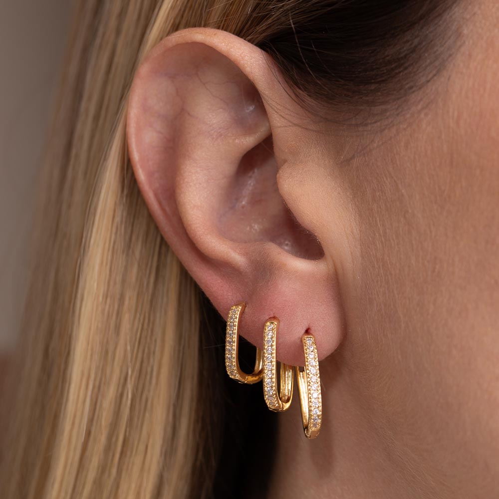 BRINCO ARGOLA OVAL CRAVEJADA G BANHO OURO 18K