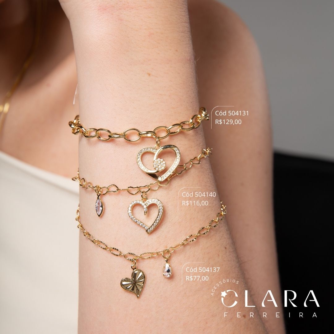 PULSEIRA ELOS CORAÇÕES ENTRELAÇADOS C/ PINGENTE CORAÇÃO MICROZIRCÔNIAS VAZADO E 1 TIFFANY NAVETE 7MM PENDURADOS - 17CM - Dourado - LIMITADA