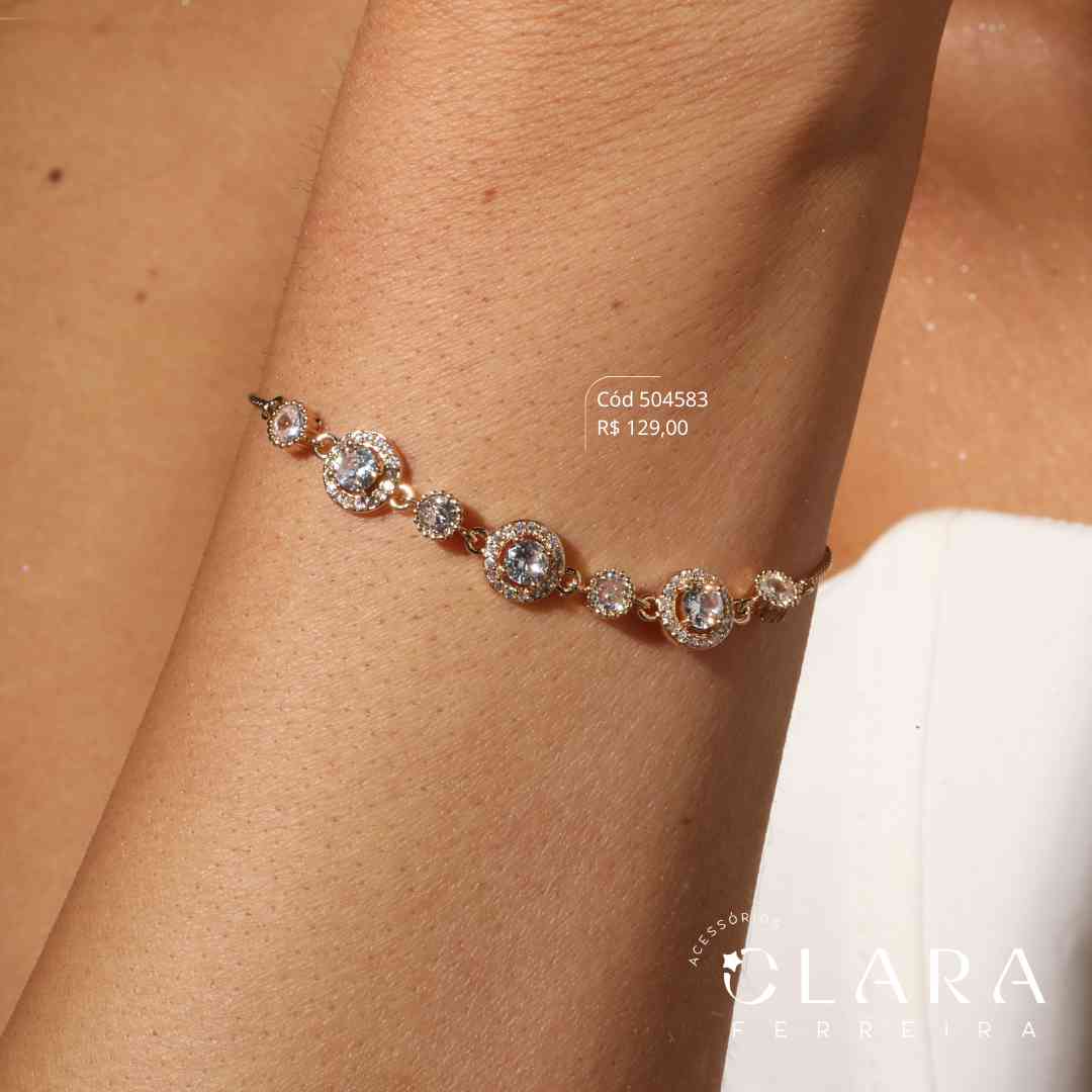 PULSEIRA AJUSTÁVEL VENEZIANA C/ MEIO 3 ZIRCÔNIAS REDONDA ADORNADAS MICROZIRCÔNIAS E 4 ZIRCÔNIAS REDONDAS 3MM CAIXA INGLESA FUNDIDA - Dourado